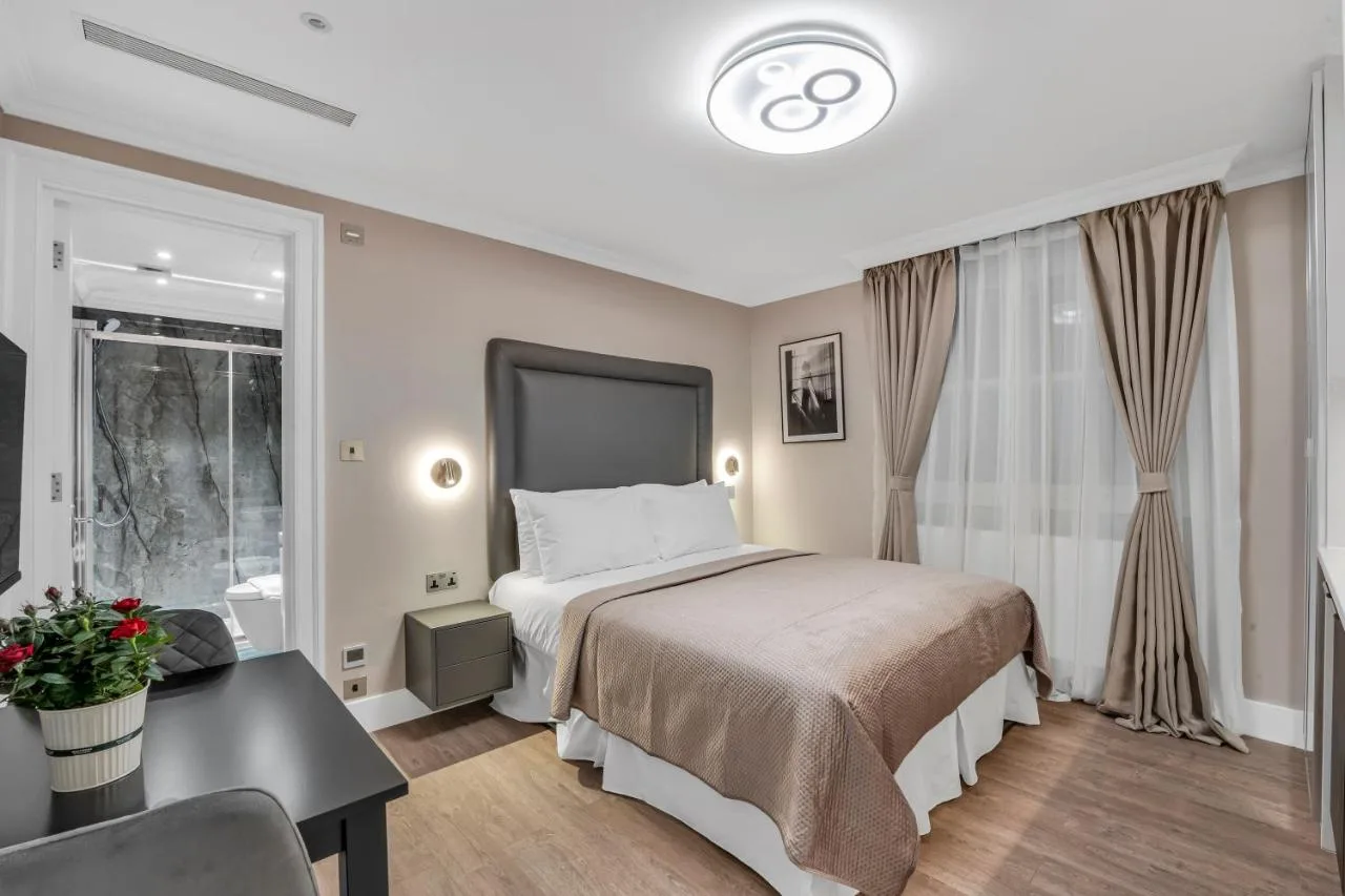 Bedroom with desk and window at Cleveland Residences Bloomsbury